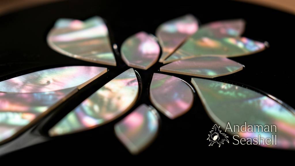 Iridescent mother-of-pearl pieces set into black lacquer